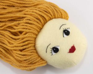 back hair sewn to the doll's head