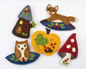 Owl, fox, treehouse, pumpkin and toadstool felt ornament from the Fall Forest chapter of the book Felt Ornaments for All Occasions