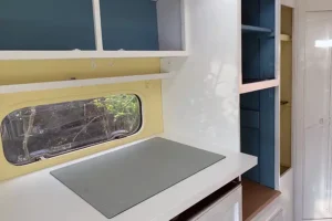 Newly painted caravan cupboards with doors removed