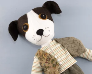 Toby's head and upper body, showing the contrast pattern lining of his waistcoat.