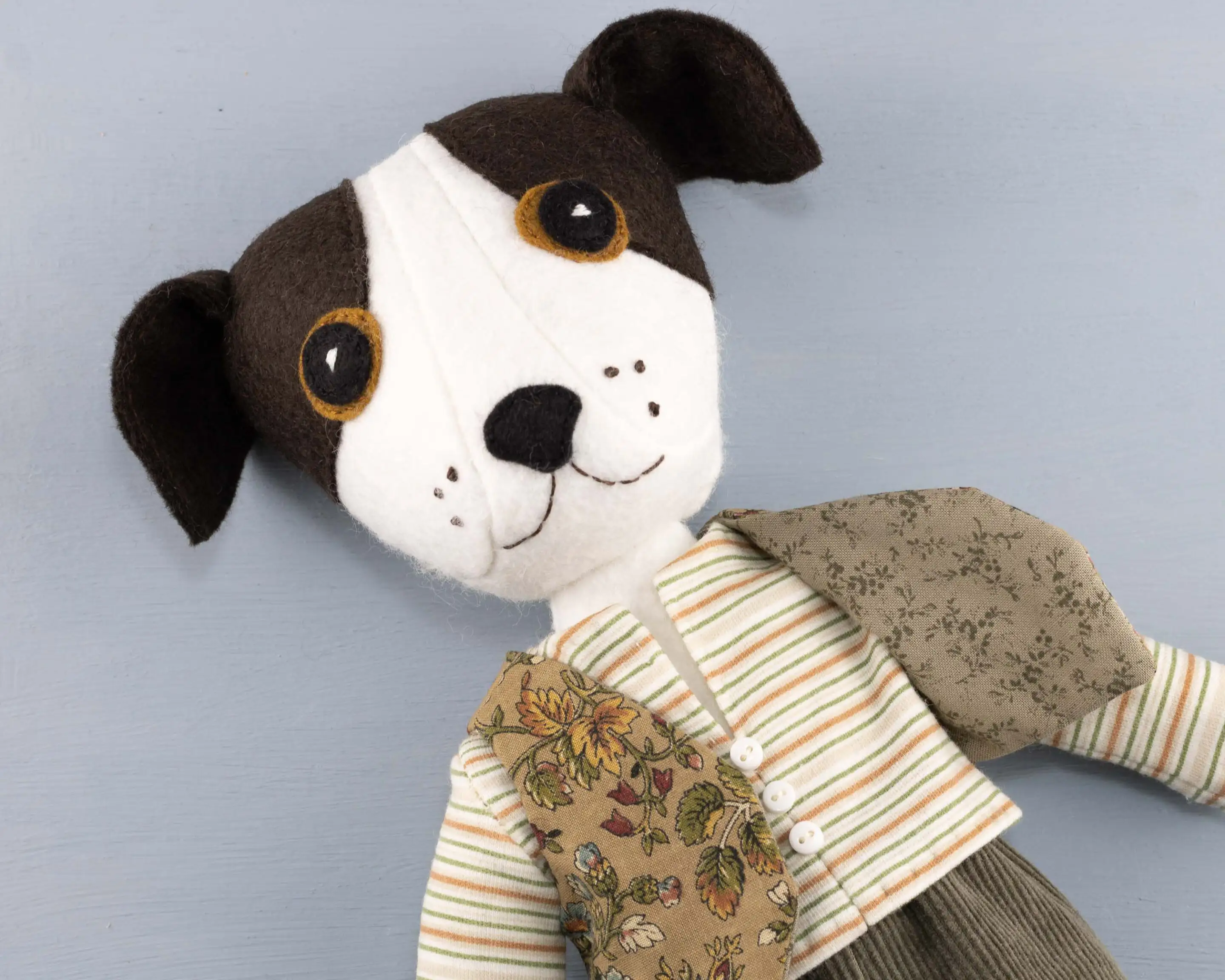 Toby's head and upper body, showing the contrast pattern lining of his waistcoat.