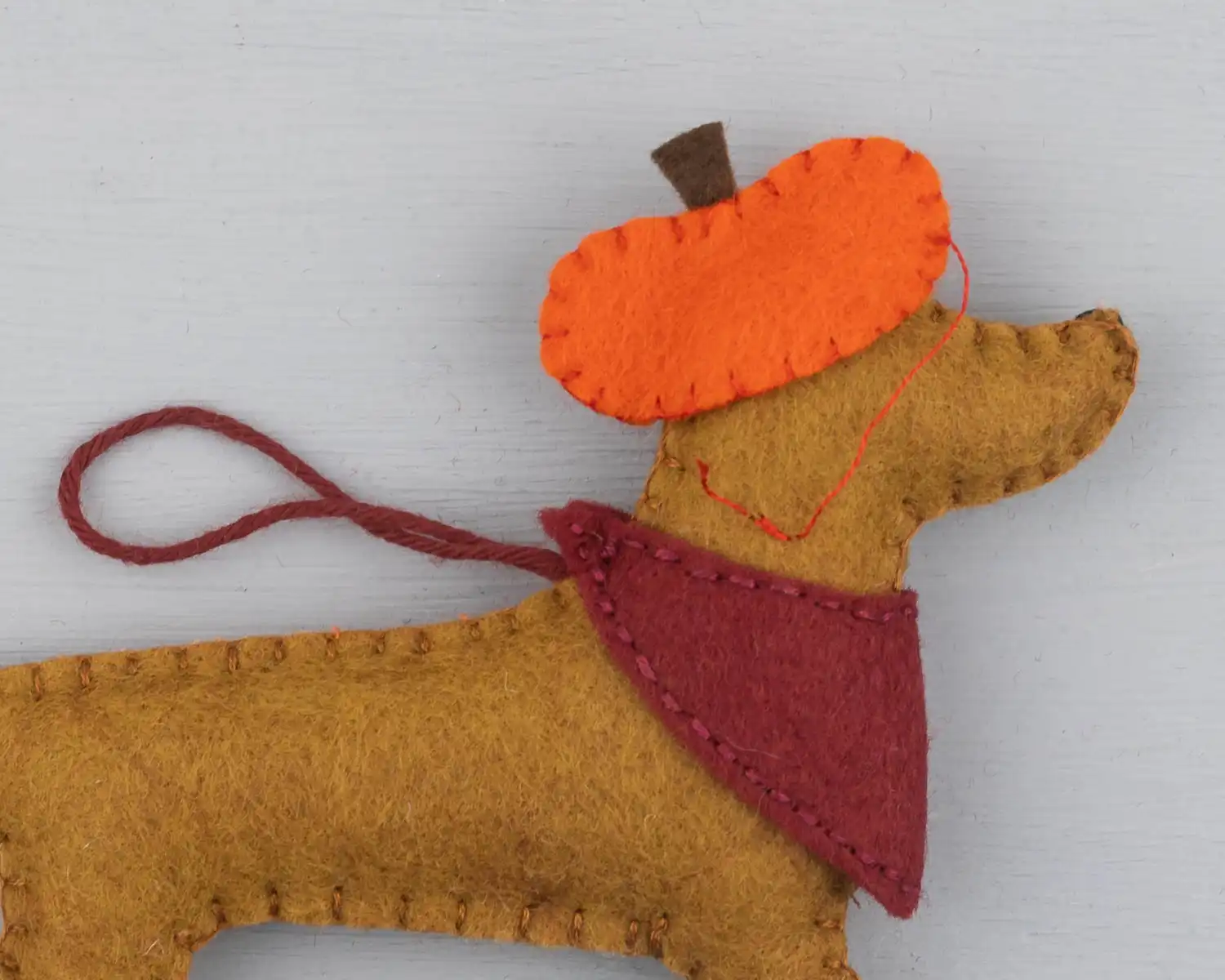 Back view of the Dachshund showing a thread fastening on the hat