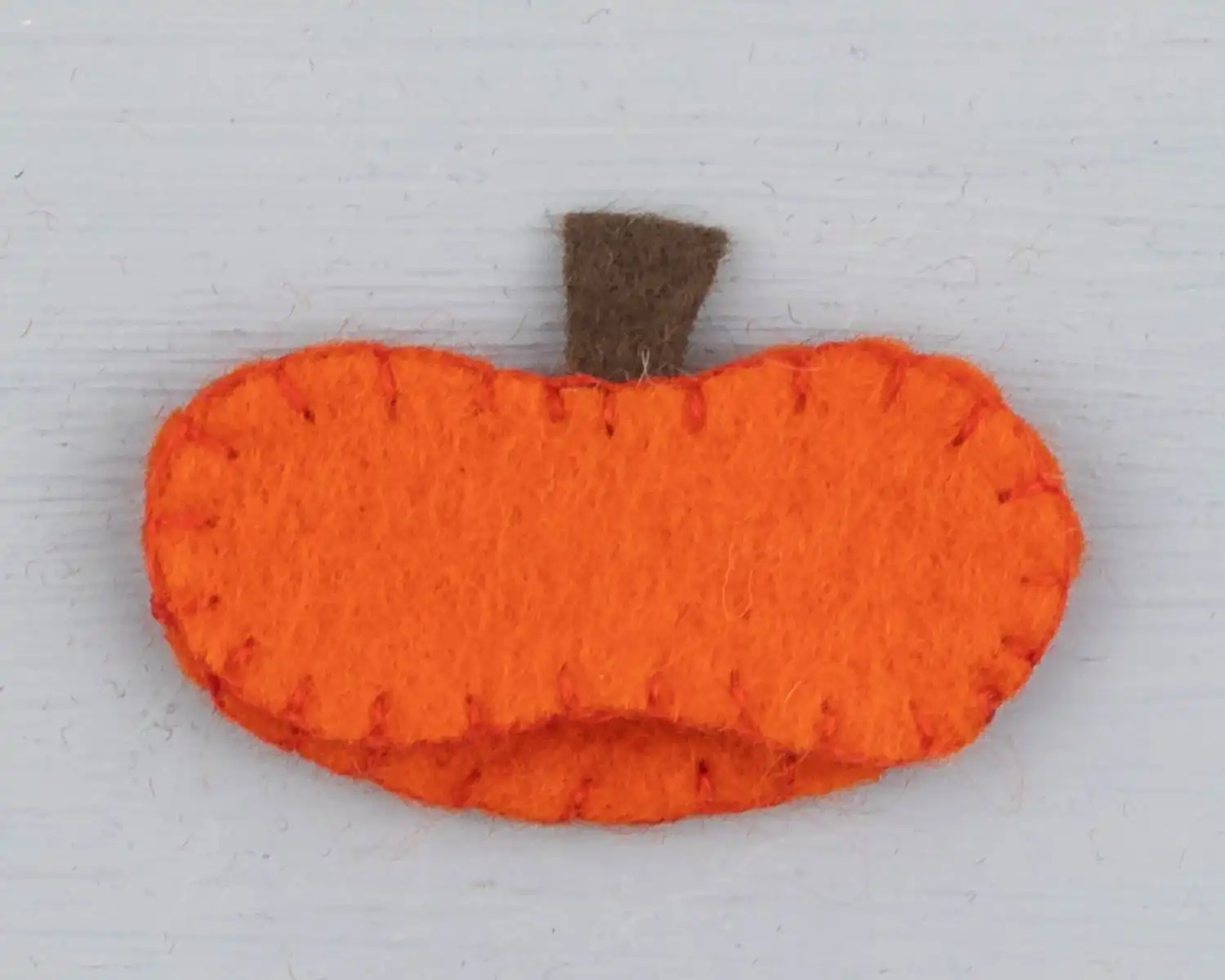 The pumpkin hat stitched together